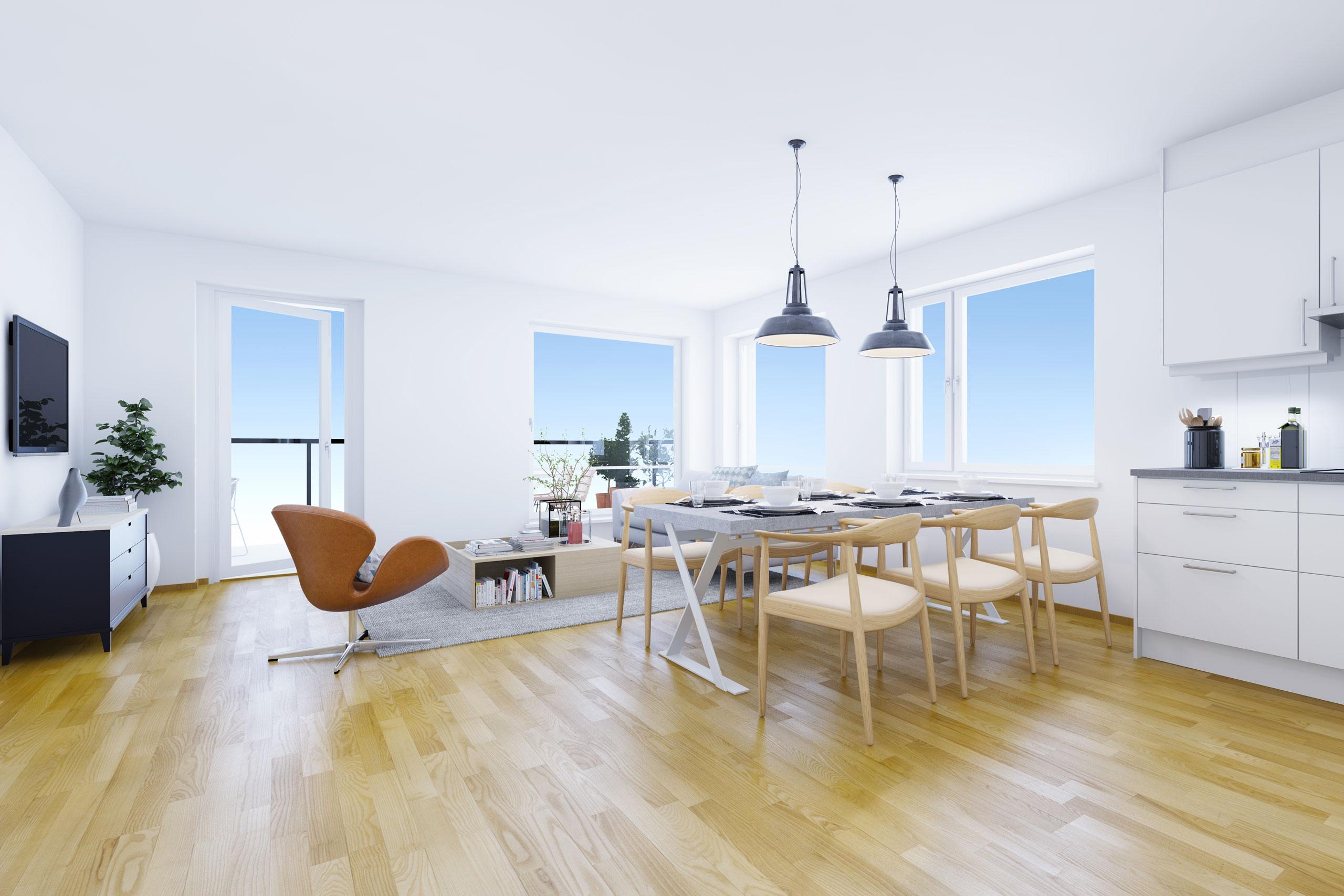 Stor og moderne stue med sofa, en lenestol og tv. Har også tilknyttet kjokken